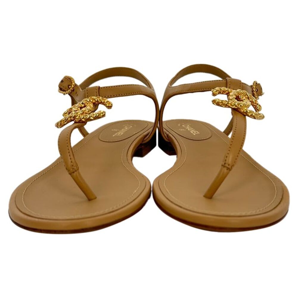 Chanel Logo T-Strap Flat Sandals in Tan Leather